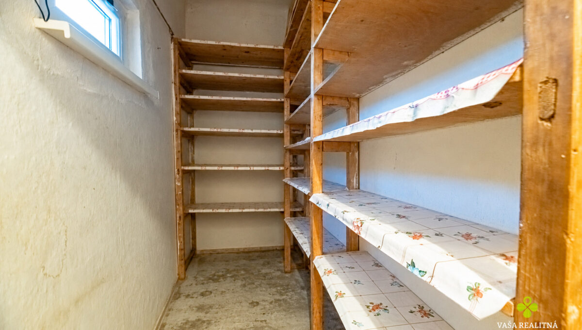 Empty pantry with original shelves