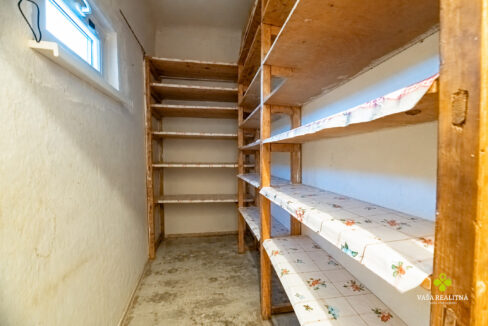 Empty pantry with original shelves
