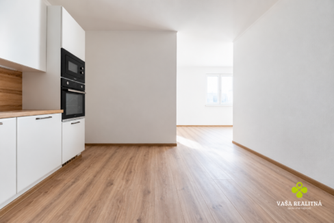 Minimal Sunlit Kitchen and Hallway