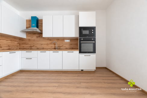 Minimalist White Kitchen with Teal Hood